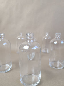 SMALL CLEAR GLASS BOTTLE VASE