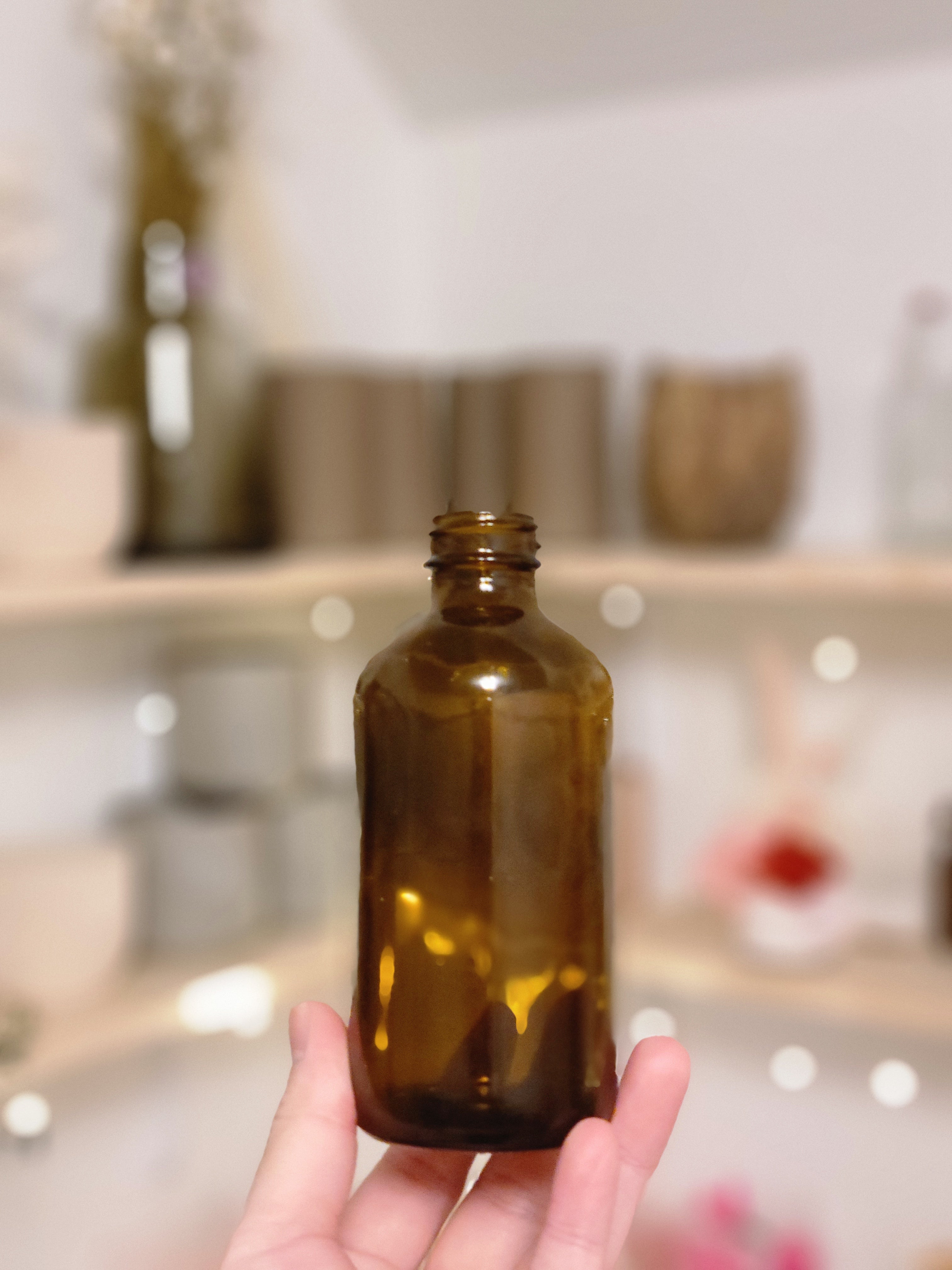 SMALL AMBER GLASS BOTTLE VASE