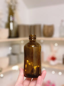 SMALL AMBER GLASS BOTTLE VASE
