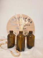 Load image into Gallery viewer, SMALL AMBER GLASS BOTTLE VASE
