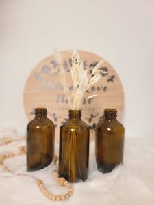 SMALL AMBER GLASS BOTTLE VASE